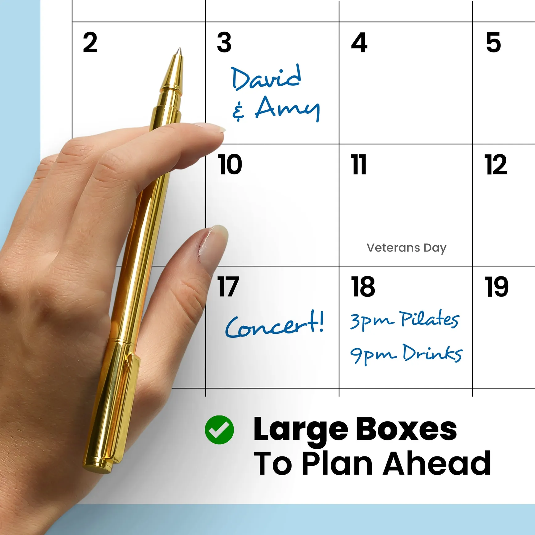 Large grid day boxes on the Oops Cats calendar, handwritten plans beside a culprit cat